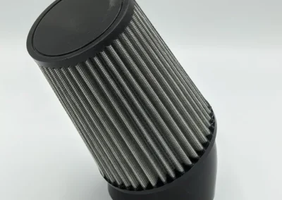 Clamp neck filter mounted at a 45-degree angle for directional fluid or air flow