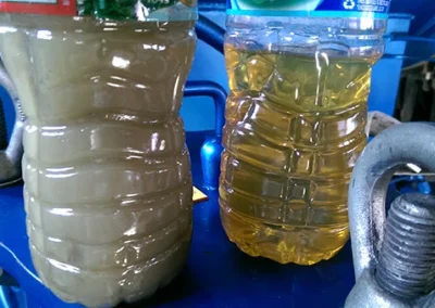 Side-by-side comparison of emulsified oil before and after treatment with a vacuum dehydrator system
