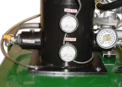 System gauges on PFC pneumatic flushing skid for monitoring pressure and filtration performance
